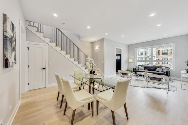 dining space featuring light wood-type flooring