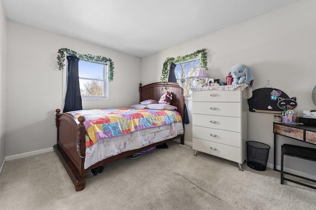 carpeted bedroom with baseboards