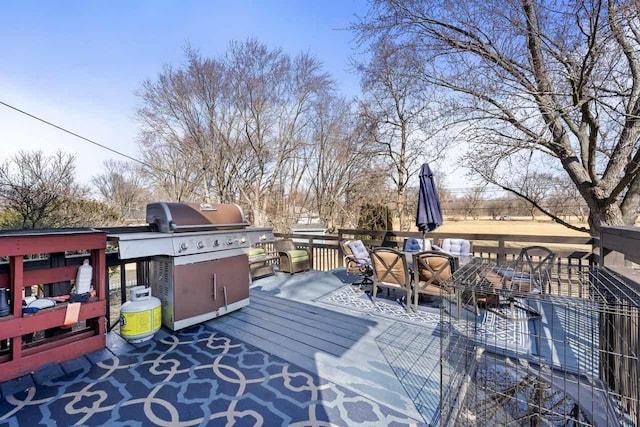 deck featuring outdoor dining area