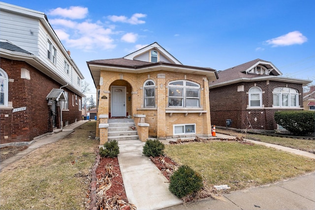 12155 S Yale Ave, Chicago, IL 60628 - bungalow with brick siding and a front yard