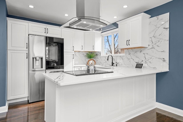 kitchen with white cabinetry, kitchen peninsula, stainless steel refrigerator with ice dispenser, sink, and island range hood