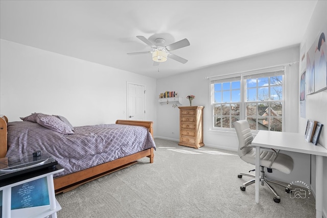 carpeted bedroom with baseboards and ceiling fan