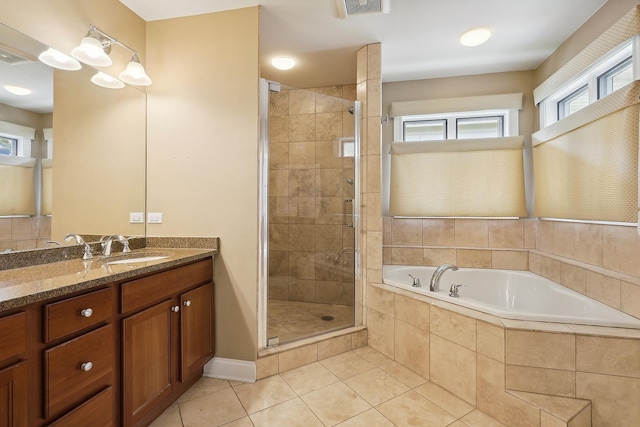full bath featuring a stall shower, visible vents, a garden tub, tile patterned flooring, and vanity