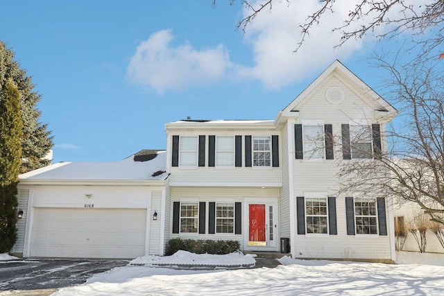 colonial-style house featuring a garage