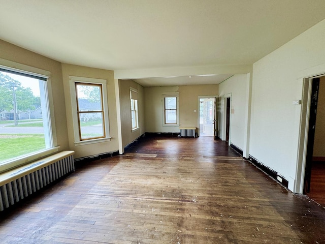 1313 Porter Ave, Lasalle, IL 61301 - spare room with radiator, hardwood / wood-style floors, and radiator heating unit