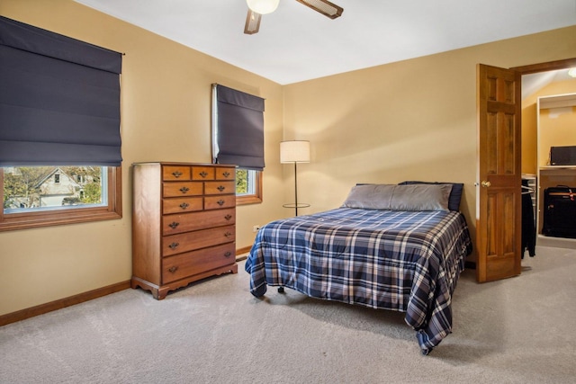 bedroom featuring a ceiling fan, carpet, and baseboards