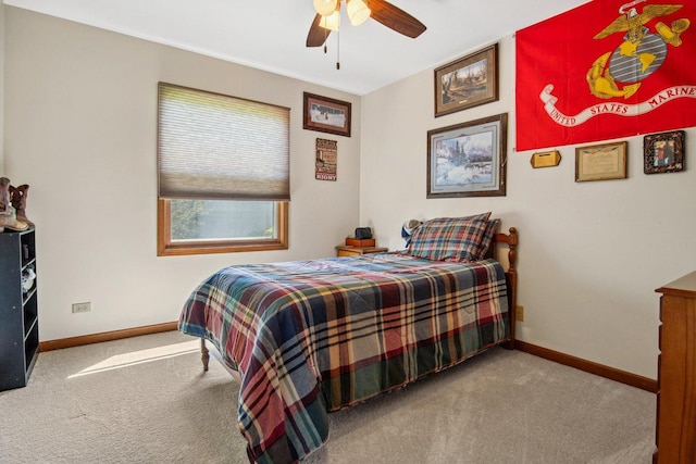 carpeted bedroom featuring a ceiling fan and baseboards