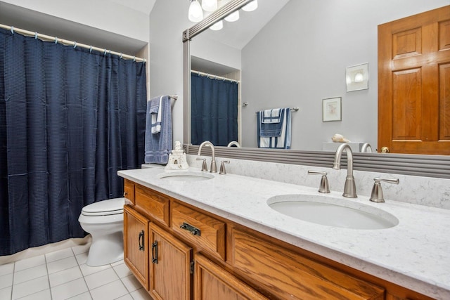 bathroom with lofted ceiling, a sink, toilet, and tile patterned floors