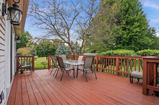 deck featuring outdoor dining area