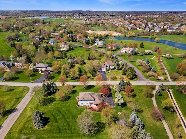 bird's eye view featuring a water view and a residential view