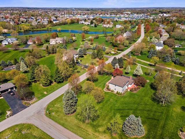 birds eye view of property featuring a water view and a residential view