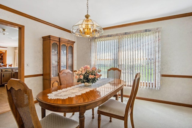 dining area with a textured wall, light carpet, crown molding, and baseboards