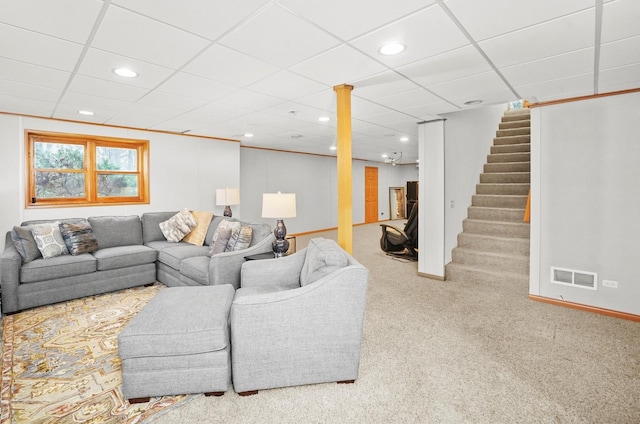 living room featuring carpet floors, stairs, recessed lighting, a drop ceiling, and baseboards