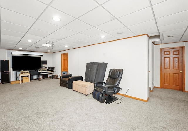 sitting room with carpet, recessed lighting, baseboards, and a drop ceiling