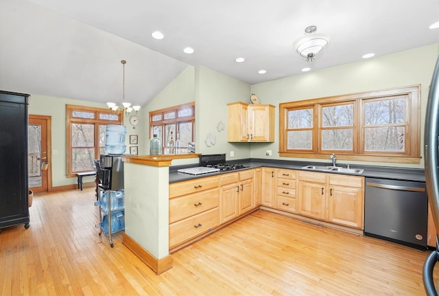 kitchen featuring dishwasher, a sink, light brown cabinets, dark countertops, and a peninsula