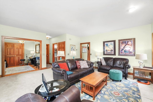 carpeted living room with baseboards