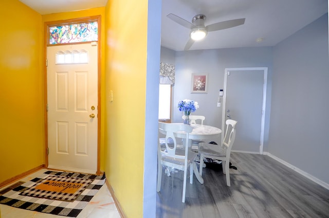 foyer with wood-type flooring and ceiling fan