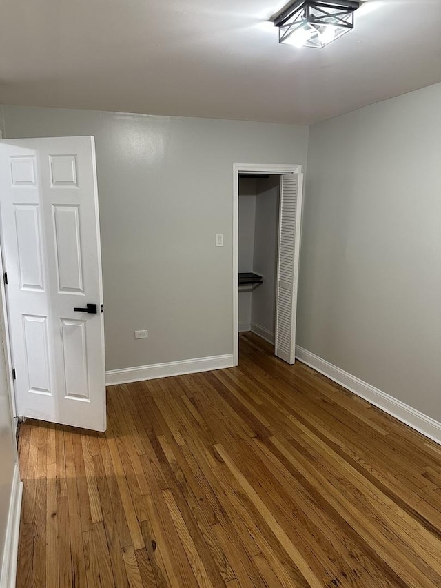 empty room featuring wood-type flooring