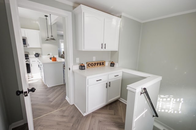 kitchen with white cabinetry, light parquet flooring, appliances with stainless steel finishes, and crown molding