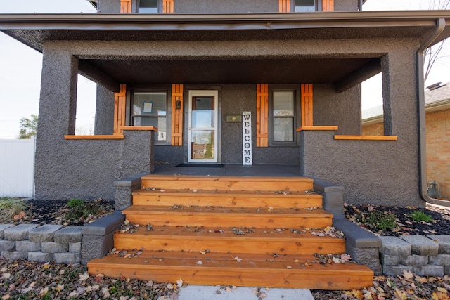 doorway to property with a porch