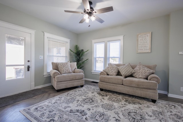 living room featuring parquet flooring and ceiling fan