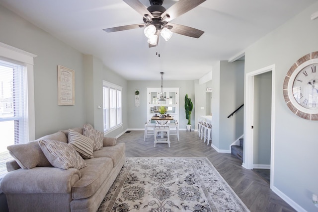 living room with parquet floors and ceiling fan