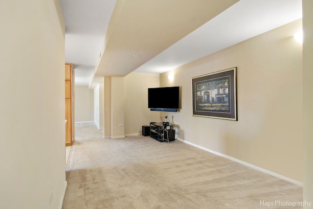 basement with light carpet and baseboards