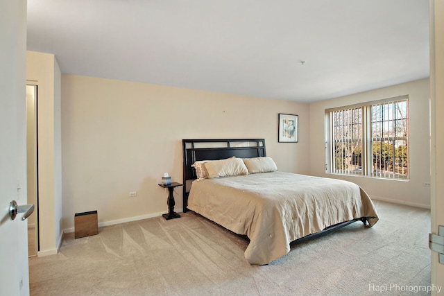 bedroom with carpet and baseboards