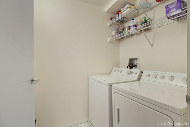 washroom featuring laundry area, tile patterned flooring, and washer and dryer