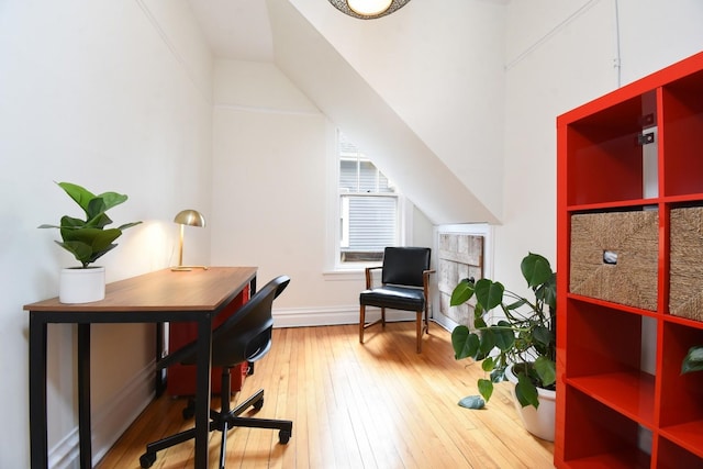 office area with light wood-style flooring and baseboards