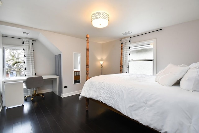 bedroom featuring dark wood-style floors, visible vents, and baseboards