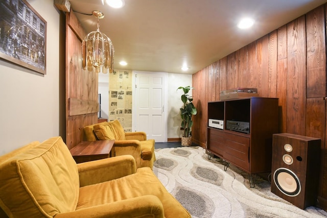 living area featuring recessed lighting and a notable chandelier