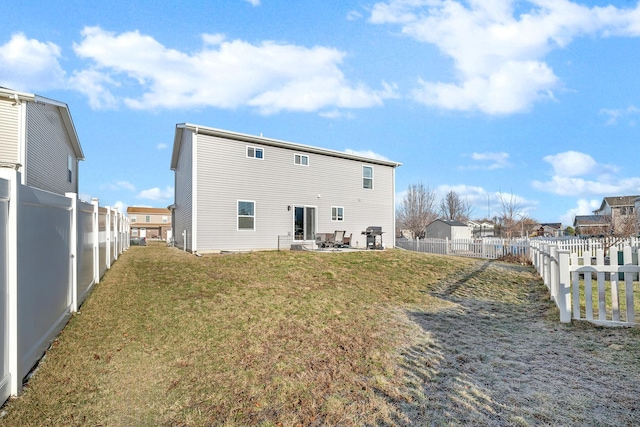 851 Western Ave, Braidwood, IL 60408 - rear view of house with a patio area, a lawn, and a fenced backyard