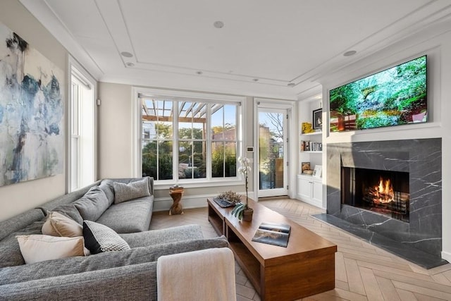 sunroom / solarium with a high end fireplace