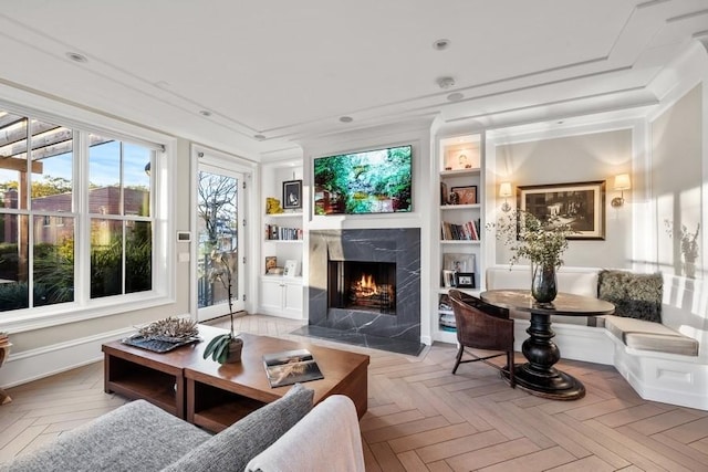 sunroom featuring a premium fireplace