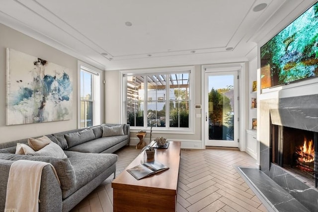 sunroom / solarium featuring a premium fireplace