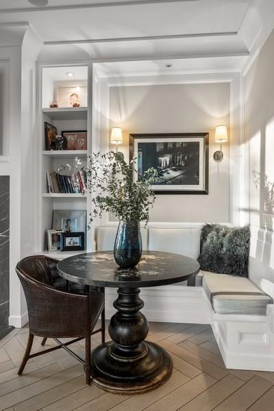 interior space featuring breakfast area, parquet flooring, and built in shelves