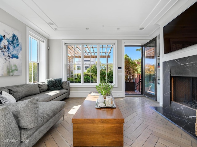 sunroom featuring a fireplace