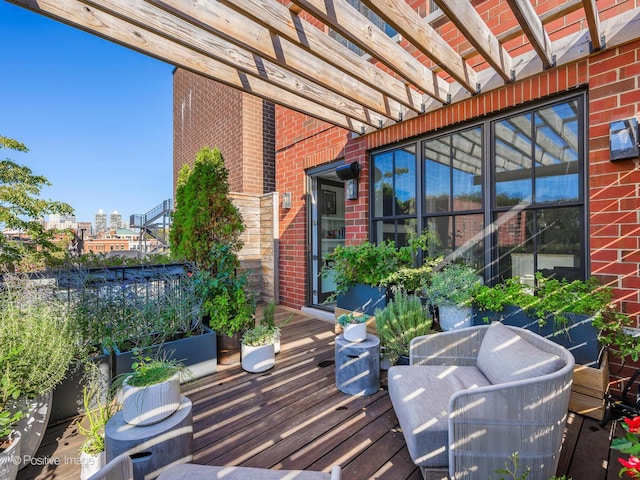 wooden deck featuring a pergola