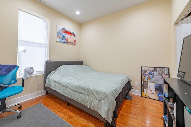 bedroom featuring wood-type flooring
