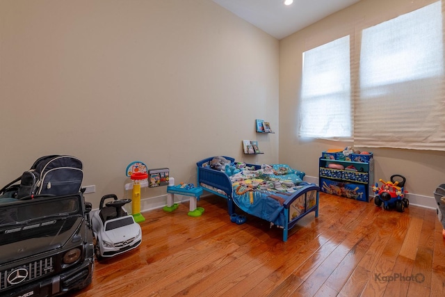 bedroom with wood-type flooring