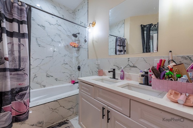 bathroom with tile walls, shower / tub combo with curtain, vanity, and decorative backsplash