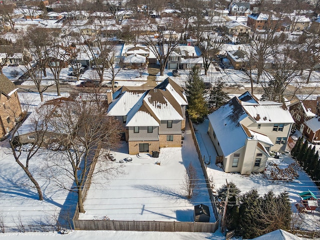 snowy aerial view with a residential view