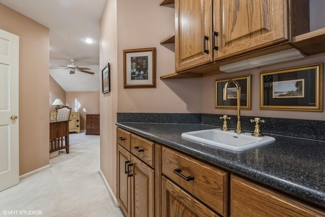 bathroom with vanity, a ceiling fan, and baseboards