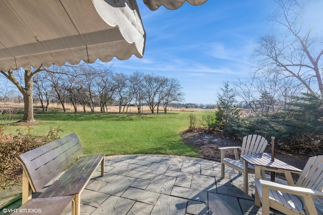 view of patio / terrace with a rural view