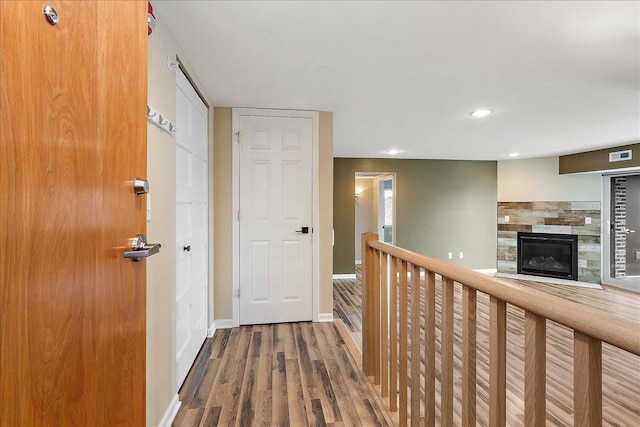 corridor featuring hardwood / wood-style floors