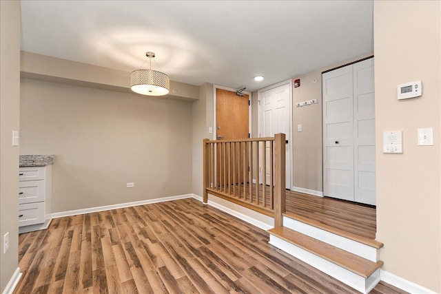 empty room with hardwood / wood-style flooring