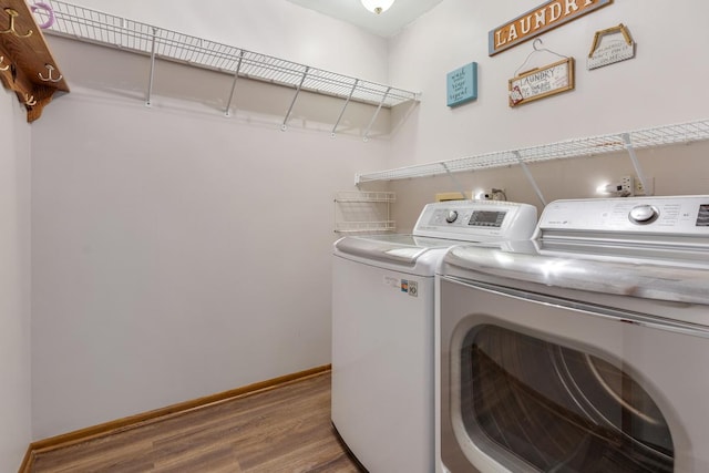 1185 Surrey Ln, Itasca, IL 60143 - washroom with washing machine and clothes dryer, wood finished floors, and baseboards