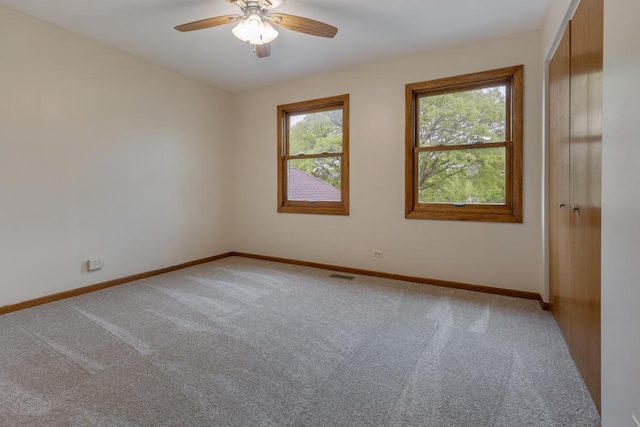 1185 Surrey Ln, Itasca, IL 60143 - empty room featuring light colored carpet, baseboards, and ceiling fan