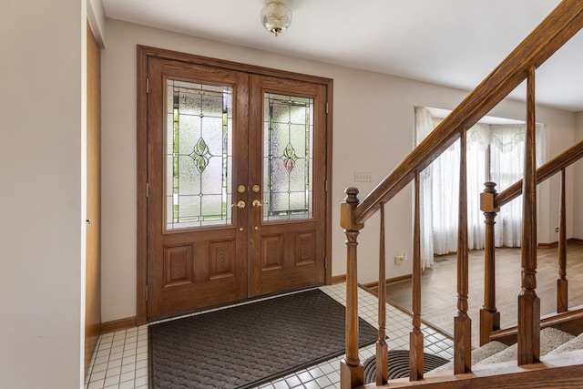 1185 Surrey Ln, Itasca, IL 60143 - foyer with stairs, baseboards, and french doors